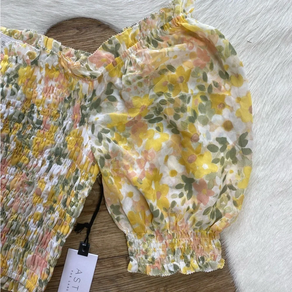 Astr the label yellow floral smocked crop top with puff sleeves.